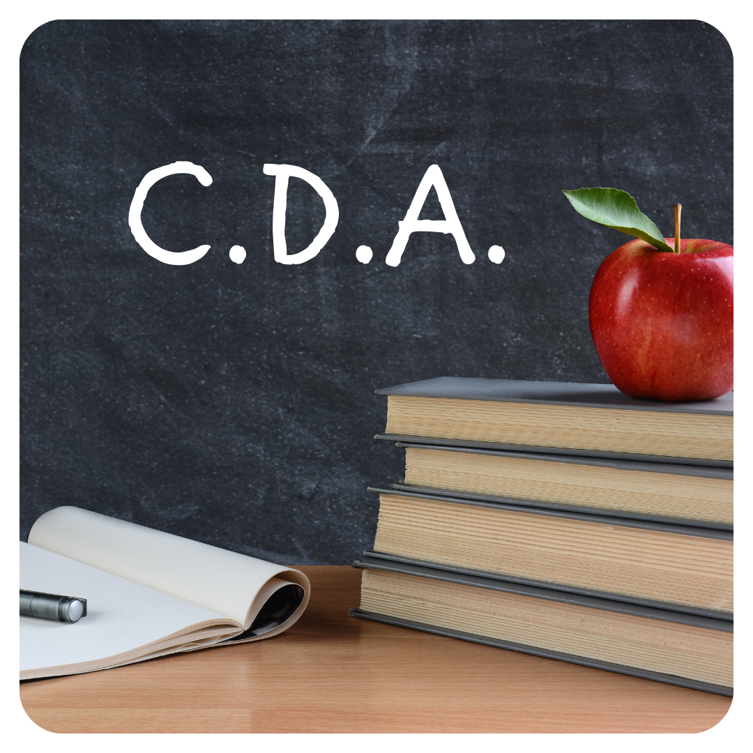 stack of books with apple and chalkboard background that reads CDA