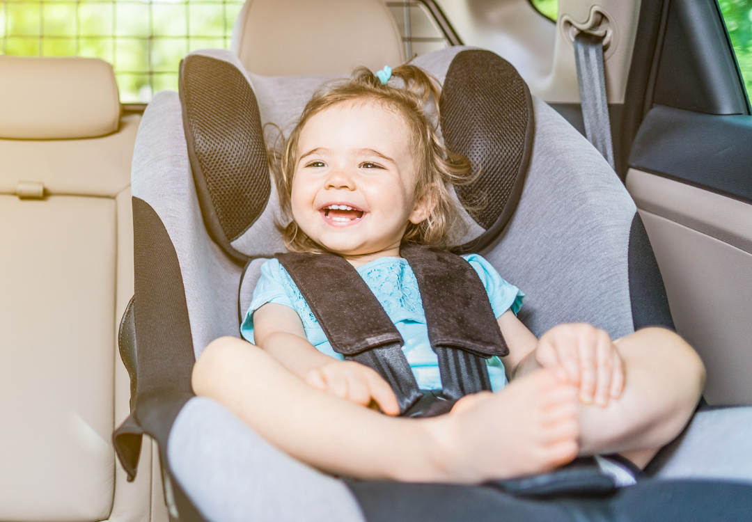Baby Smiling in Car Seat